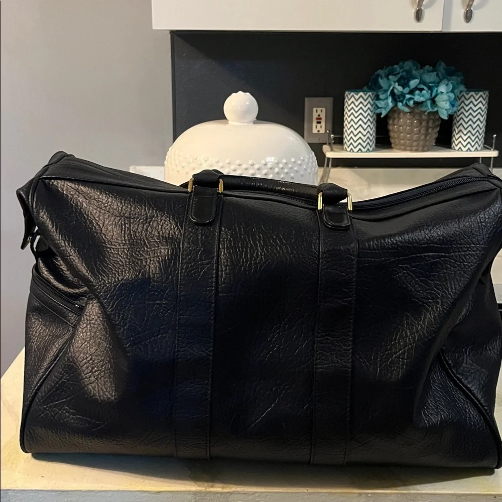 Burberrys Dark Navy Leather Bag with Embroidered Patch